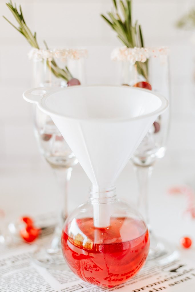 funnel on top of ornament filled with punch