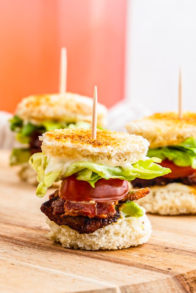 bacon lettuce and tomato between mini bread rounds